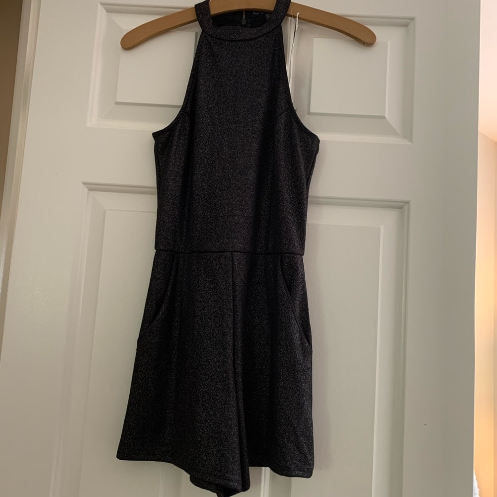 Dark grey/black romper with sparkles.